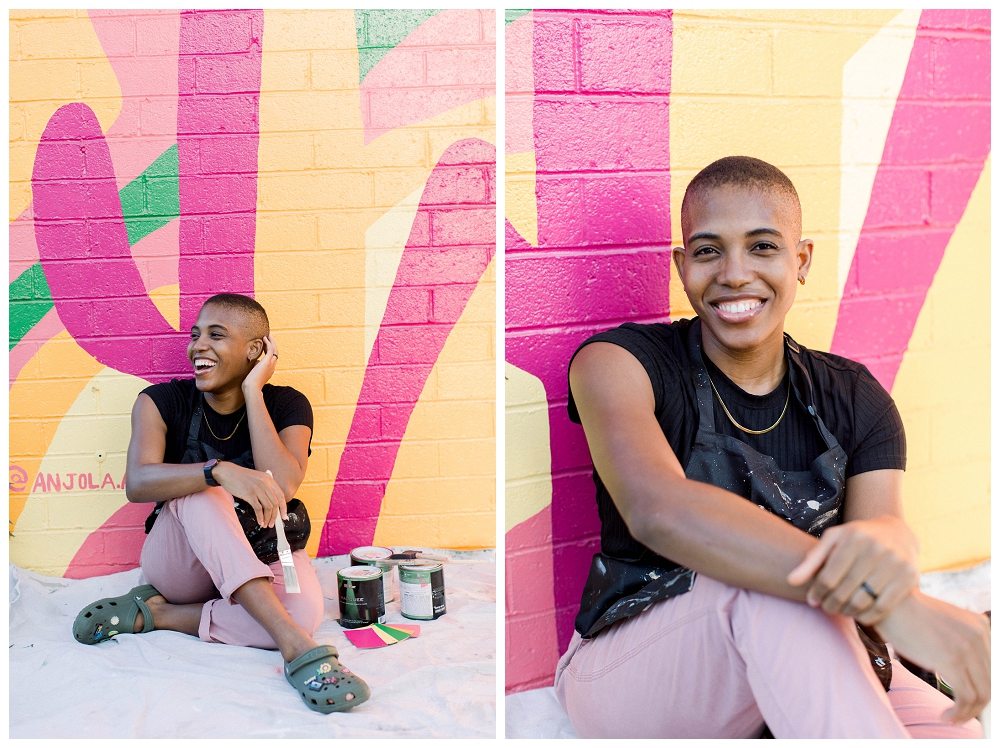 Two images side by side, both of a woman in a black top and pink pants sitting in front of a colorful desert mural