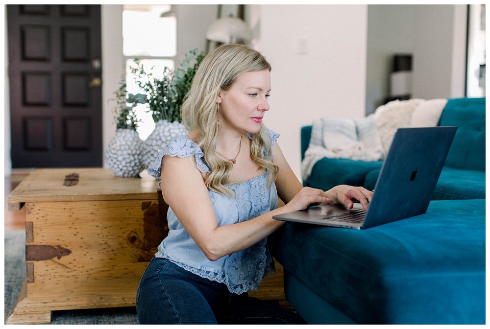 Branding portrait of a woman typing on a laptop