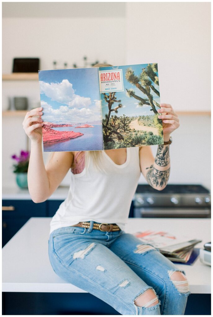Branding Portrait of a woman holding up a vintage arizona highways magazine