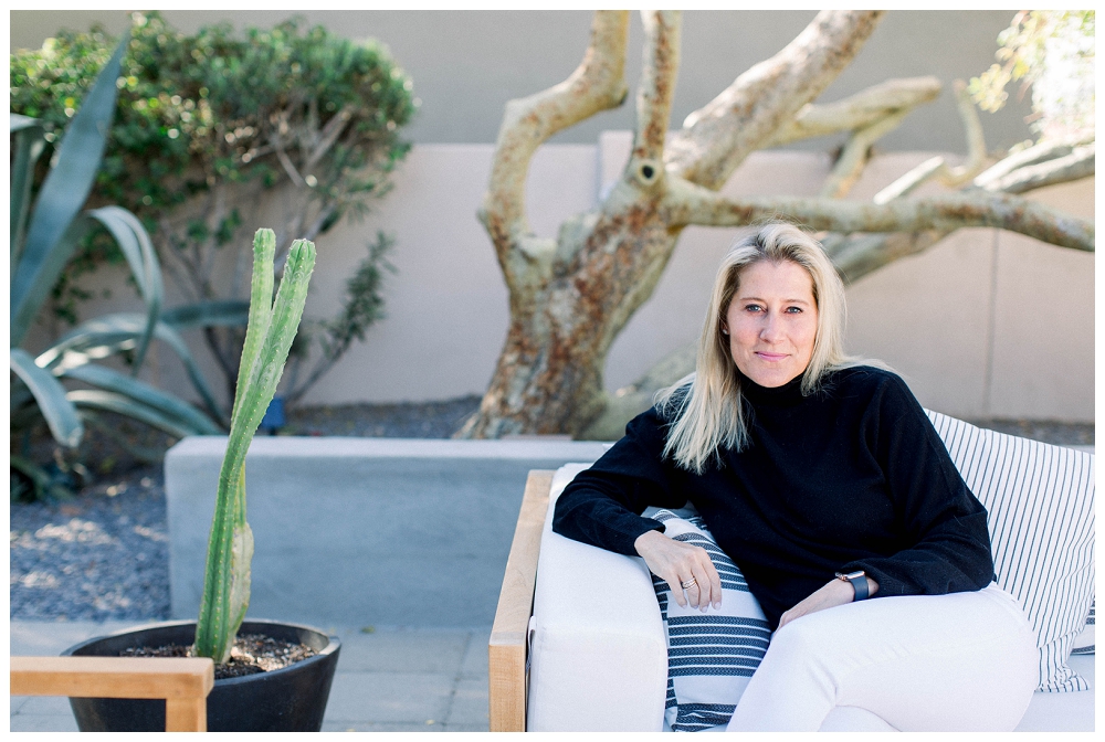 Branding Portrait a woman sits on a sofa outdoors. 